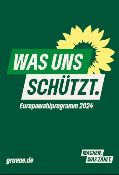 "Was uns schützt. Europawahlprogramm 2024" vor dem Grünenlogo