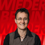Arne Gröschel Foto des Kandidaten auf rotem Hintergrund