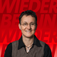 Arne Gröschel Foto des Kandidaten auf rotem Hintergrund