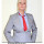 Die zukünftige Kanzlerin, gekleidet in einen grauen Anzug, ein blaues Hemd und eine rote Krawatte blickt herausfordernd in die Kamera. Darunter steht: Ist das Politik oder kann das weg?