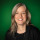 Portraitfoto Kathrin Warnecke vor dunkelgrünem Hintergrund